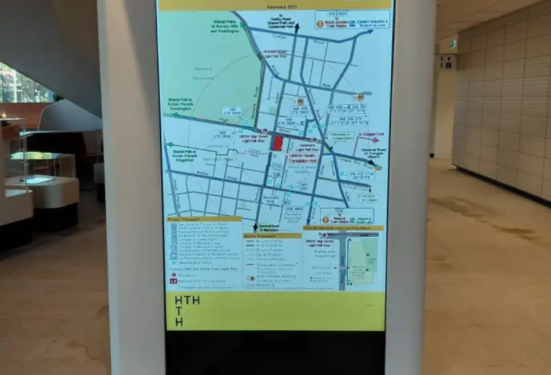 Interactive wayfinding map on a digital kiosk at the Health Translation Hub